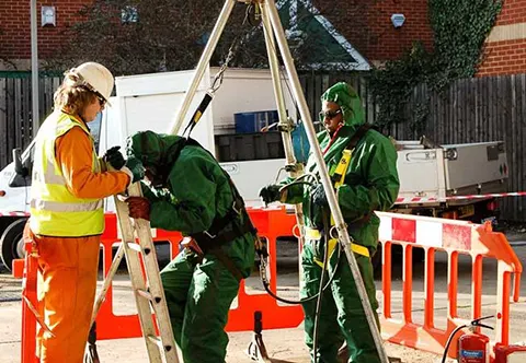 DP Man in High Vis Vest Overseeing Man Entry